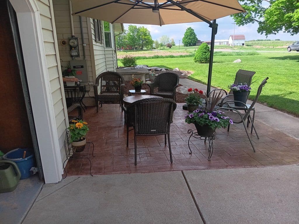 Cozy Outdoor Patio with Stylish Stamped Concrete image
