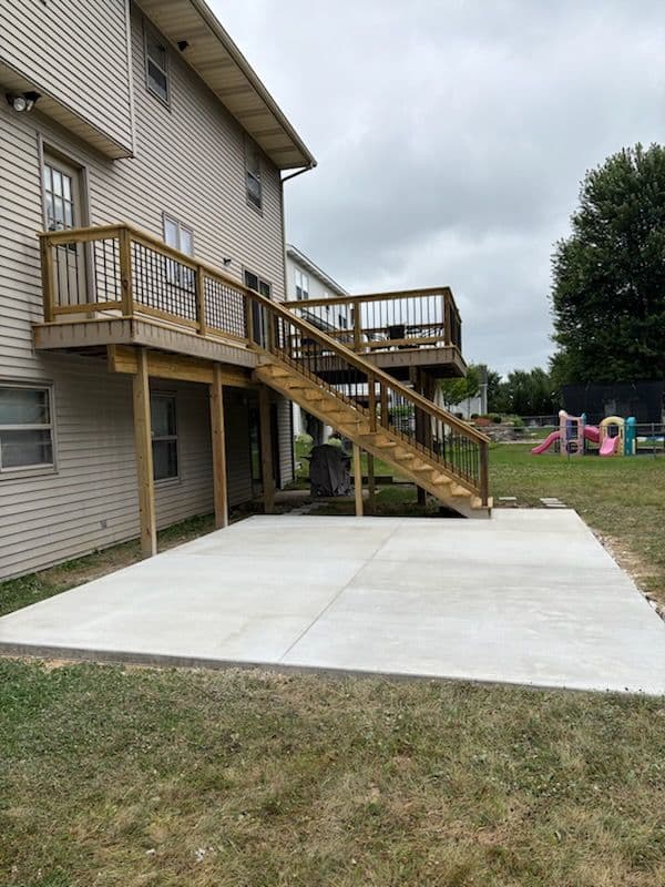 Stunning Two-Story Deck and Patio Installation image