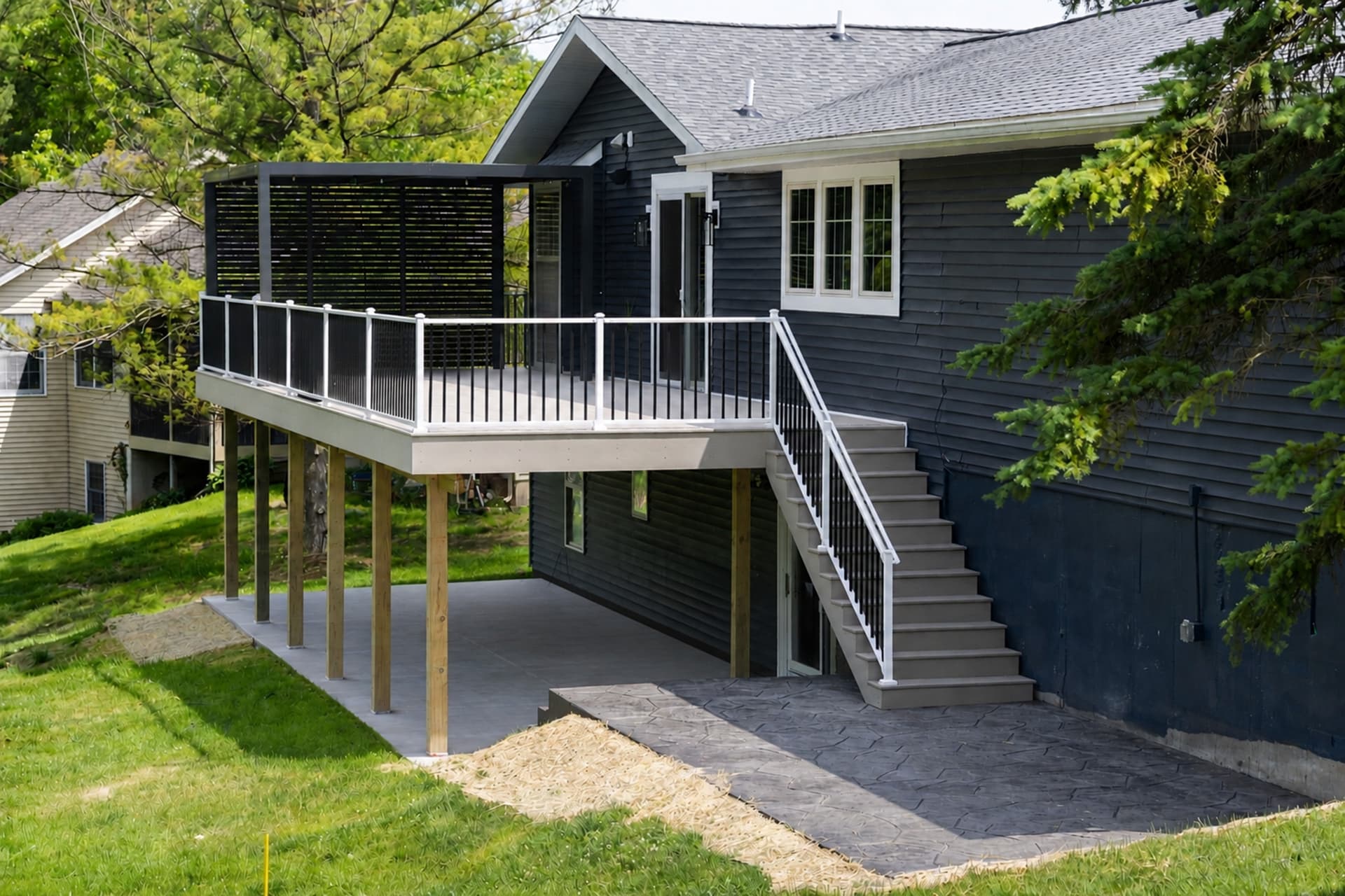 42-Foot TimberTech Deck with Stamped Concrete Patio Build image